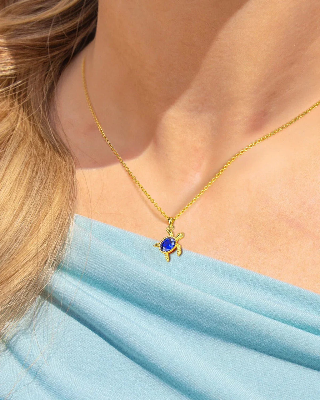 Gold Turtle Necklace with Blue Gem